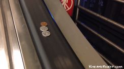 Coins On Escalator Rail thumbnail